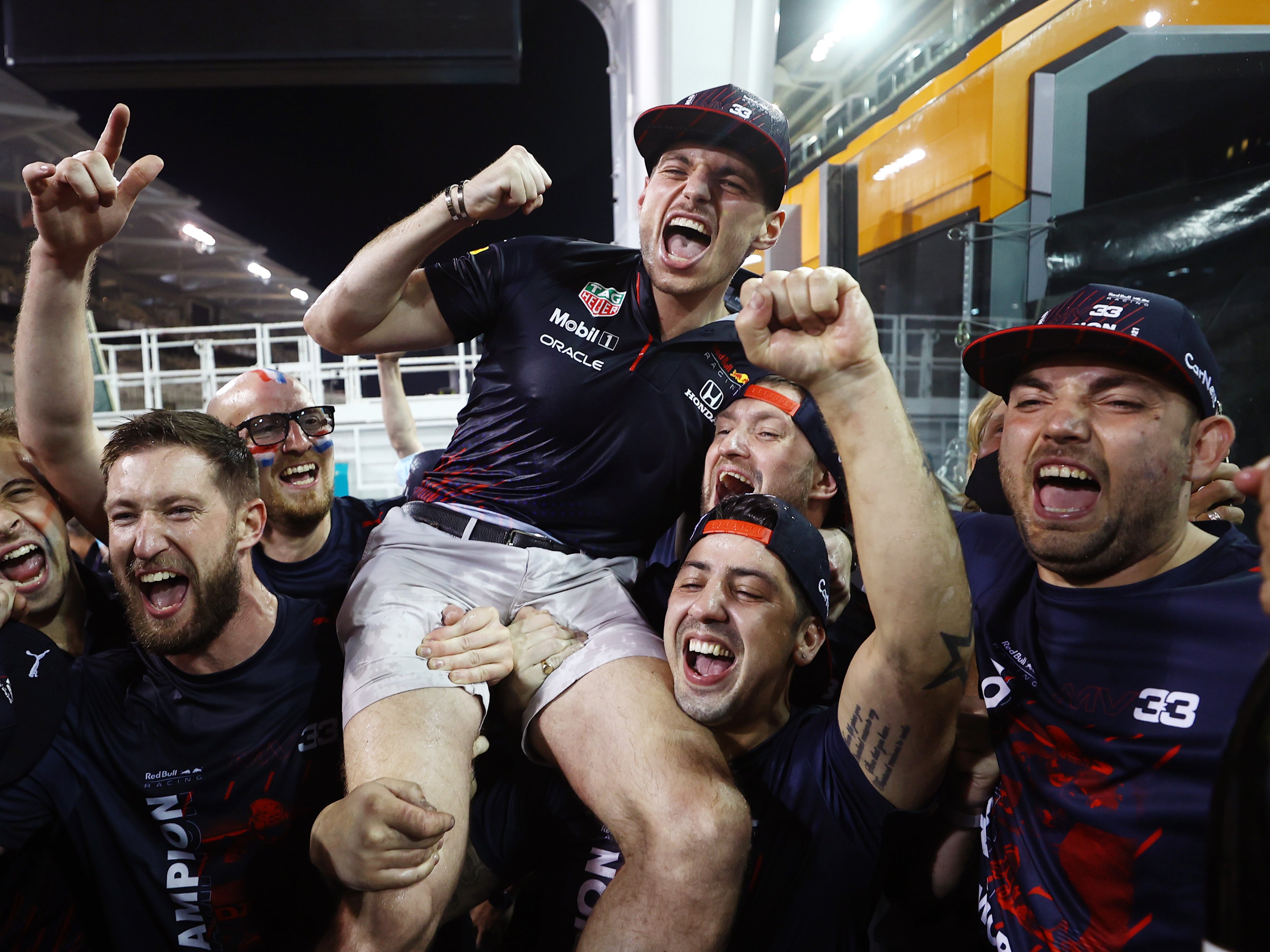 <p>Drive to thrive: the Red Bull team carry the new champion on their shoulders </p>