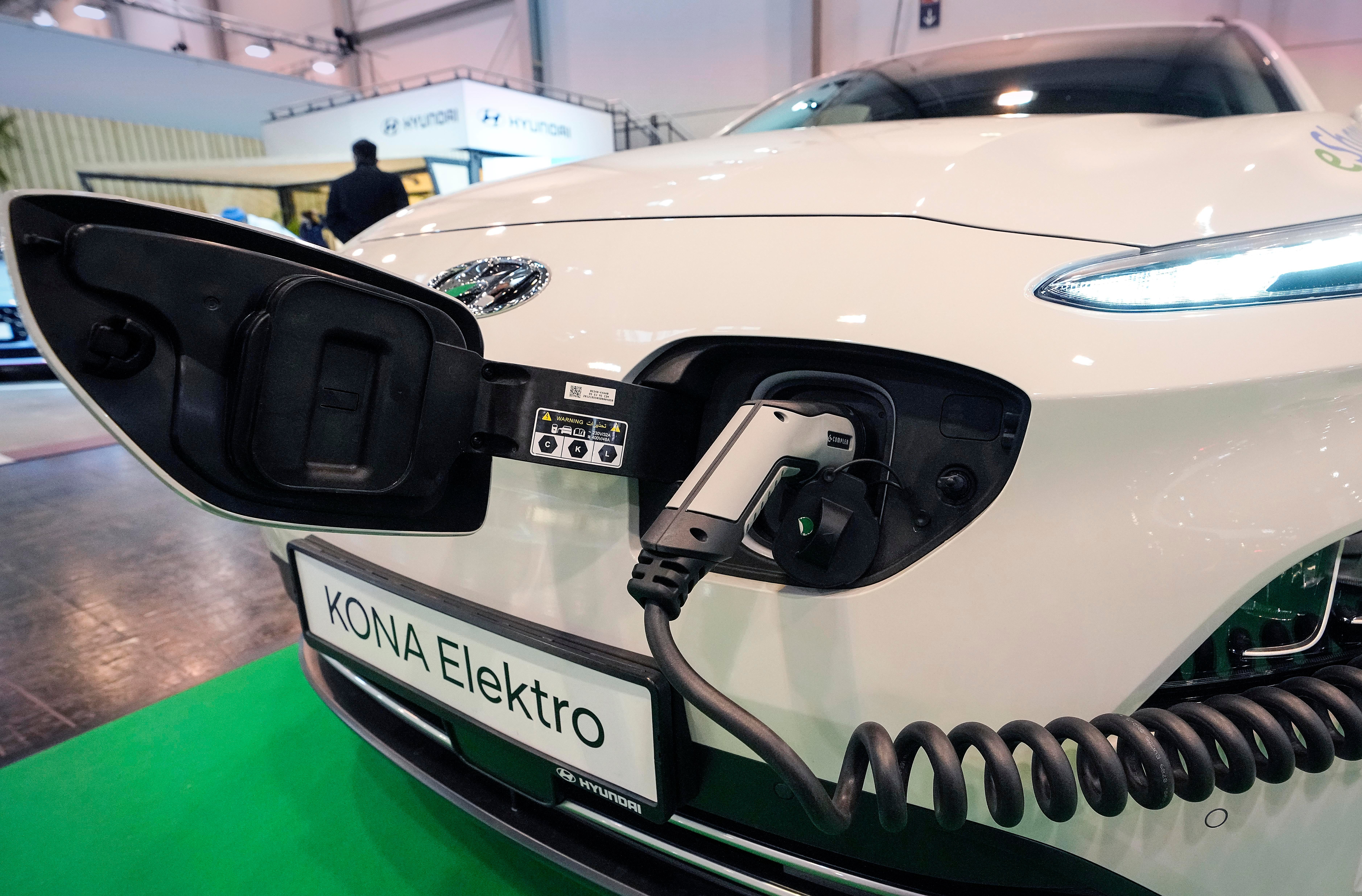 A Hyundai Kona electric car is charged at the Motor Show in Essen, Germany