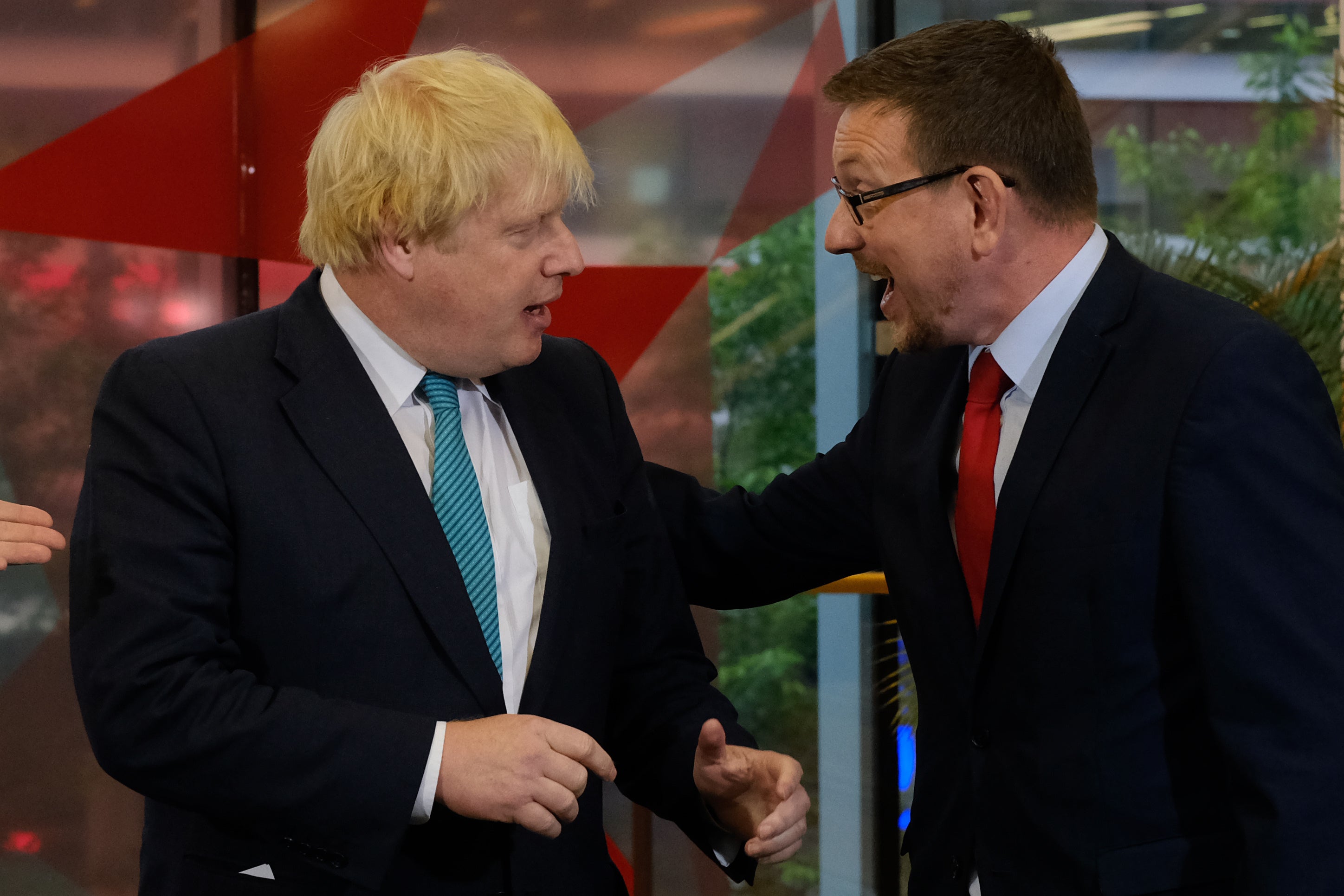 Andrew Gwynne with Boris Johnson at a general election show in 2017 (Stefan Rousseau/PA)