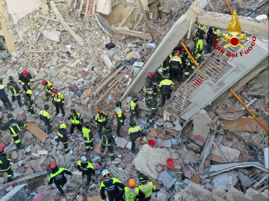 Rescuers work at the site of a gas explosion that caused several houses to collapse in Ravanusa, Sicily