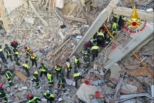 <p>Rescuers work at the site of a gas explosion that caused several houses to collapse in Ravanusa, Sicily</p>