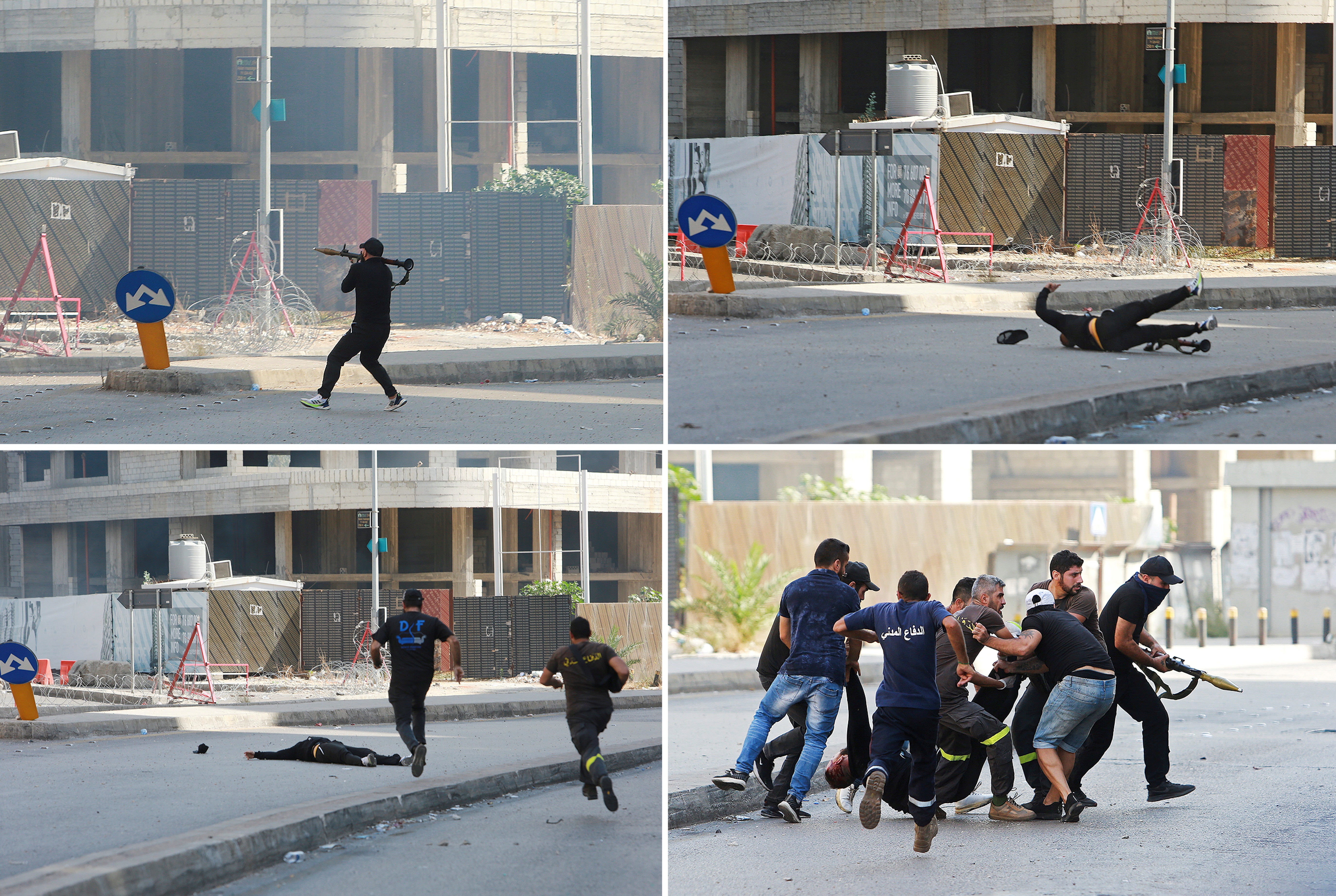 A man attempts to fire a rocket-propelled grenade, falling to the ground as he is hit by gunfire and then retrieved by onlookers, during a violent protest in Beirut, Lebanon