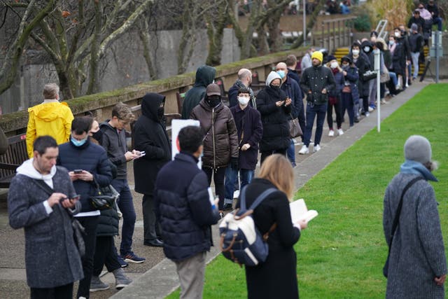 People queuing for booster jabs at St Thomas’ Hospital, London (Kirsty O’Connor/PA)