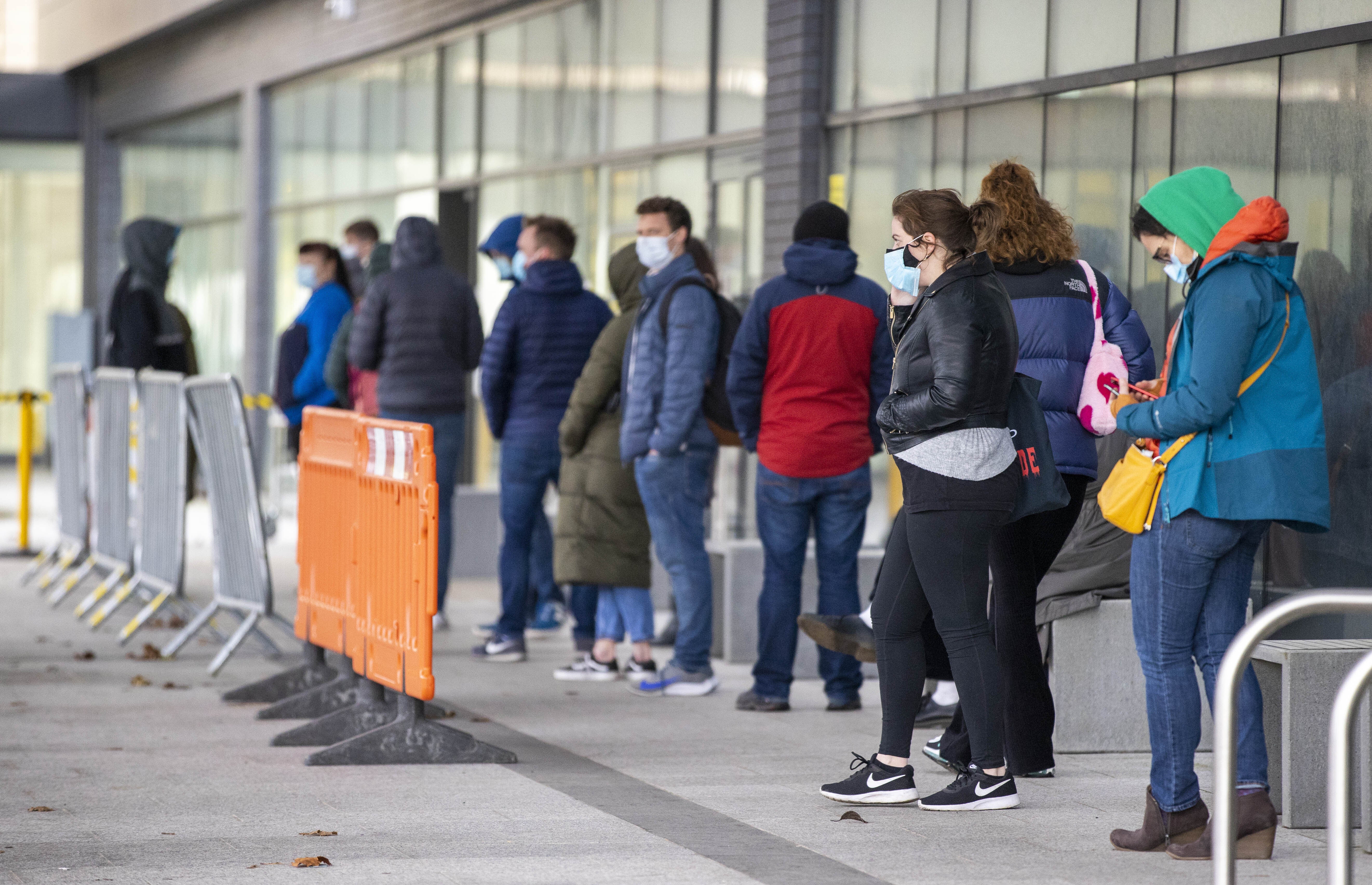 People queuing at the Covid-19 vaccination centre at Dundonald Hospital in Belfast, Northern Ireland (Liam McBurney/PA)