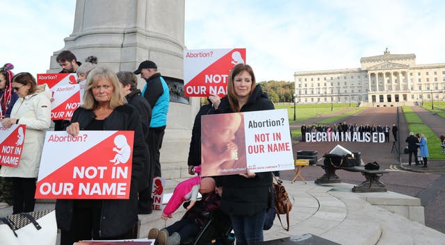 Pro choice and anti abortion campaigners at Stormont in 2019 (Niall Carson/PA)