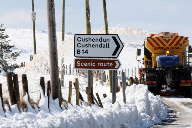 Gritters make their way down rural roads in the hills above Cushendall in Co Antrim (Paul Faith/PA)