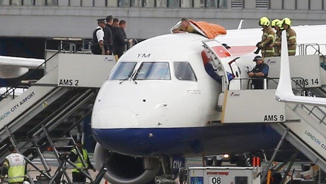 Extinction Rebellion activist James Brown on top of a plane on October 10 2019 during a protest against flying at London City Airport (Extinction Rebellion)