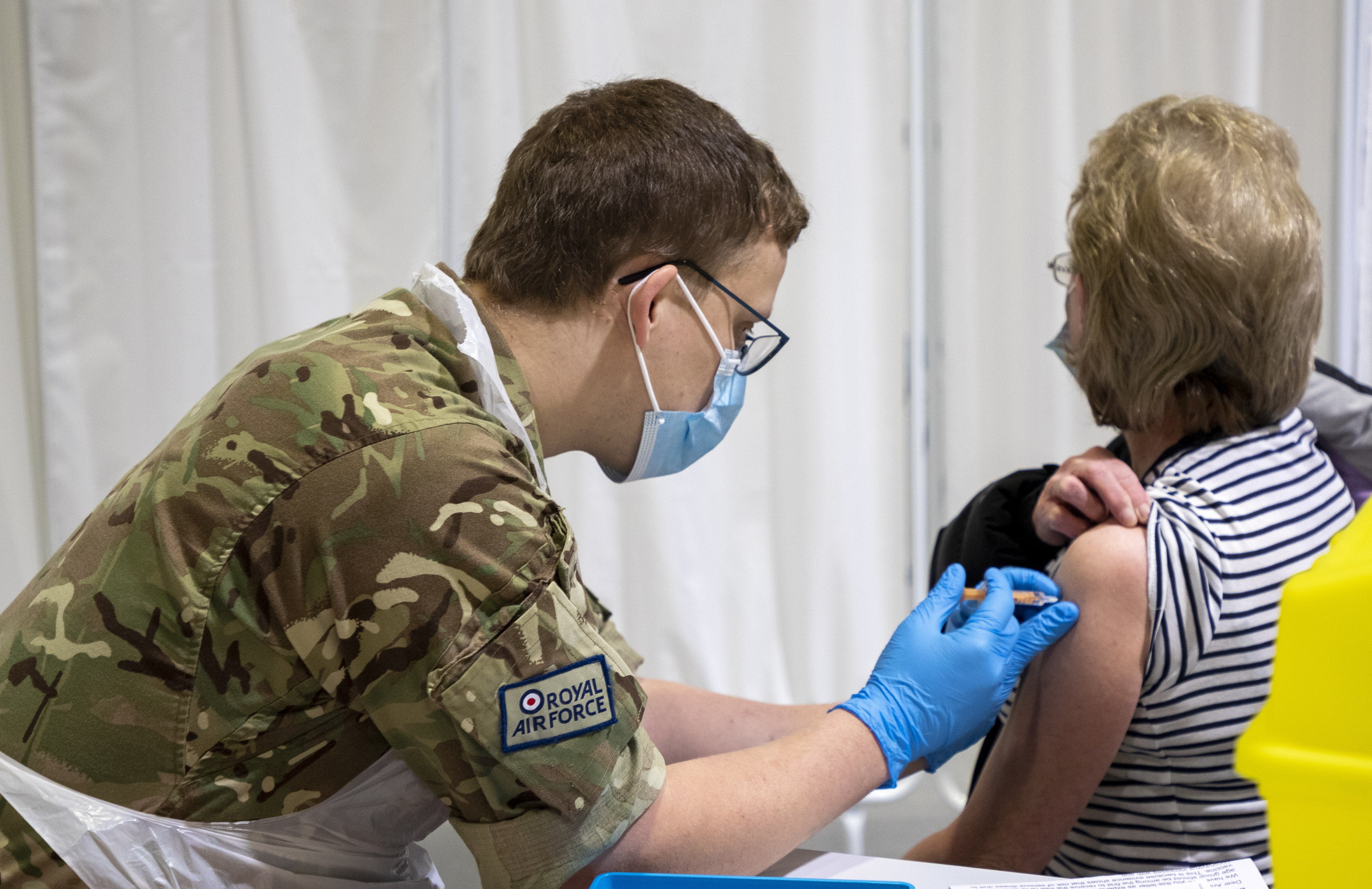 A member of the Royal Air Force giving a Covid-19 vaccination. Across the UK, members of the Armed Forces have been working to support the rollout of the coronavirus vaccine programme, with new deployments planned in Scotland and North West England. Issue date: Sunday June 6, 2021.