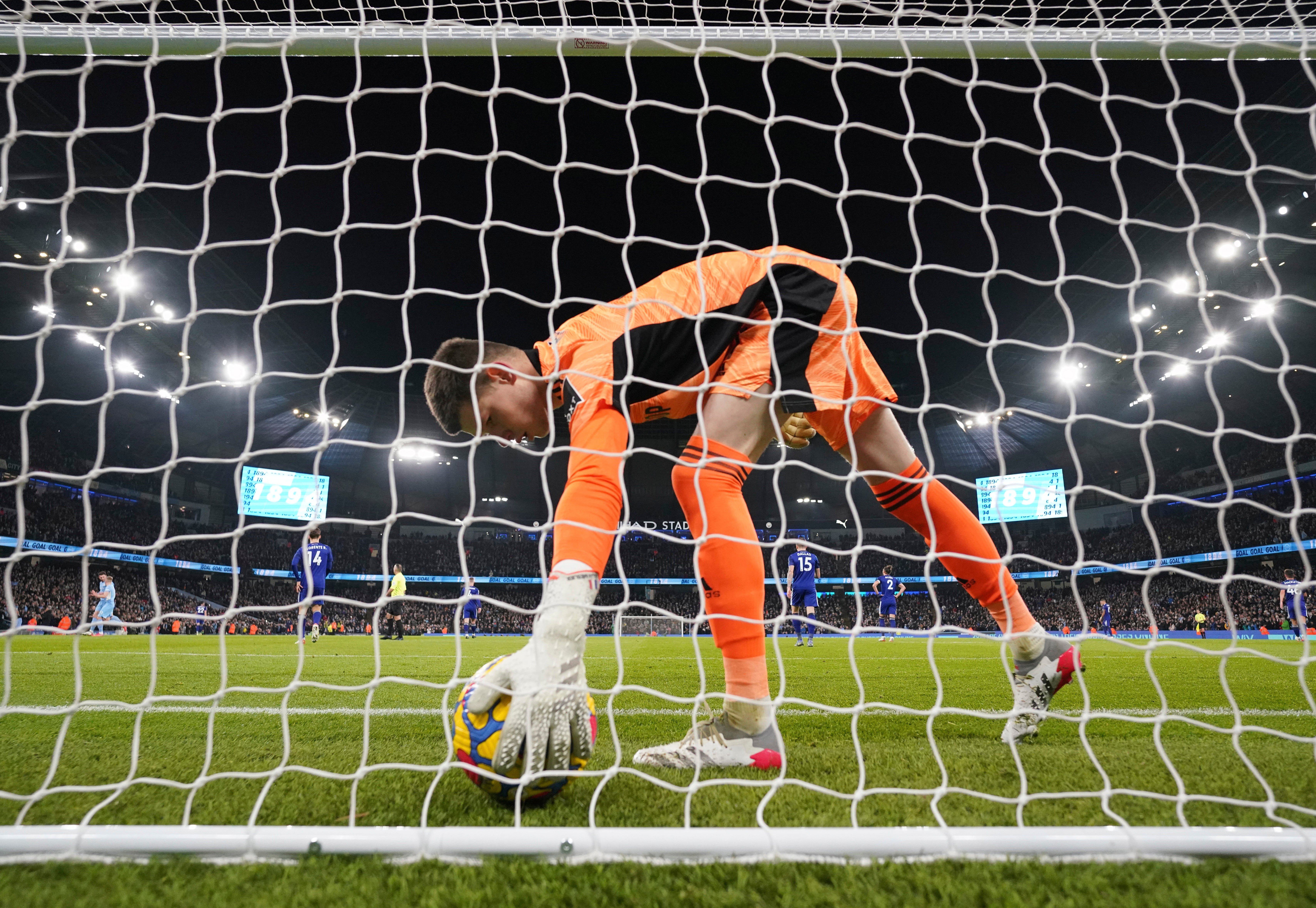 Illan Meslier retrieves the ball after another Man City goal