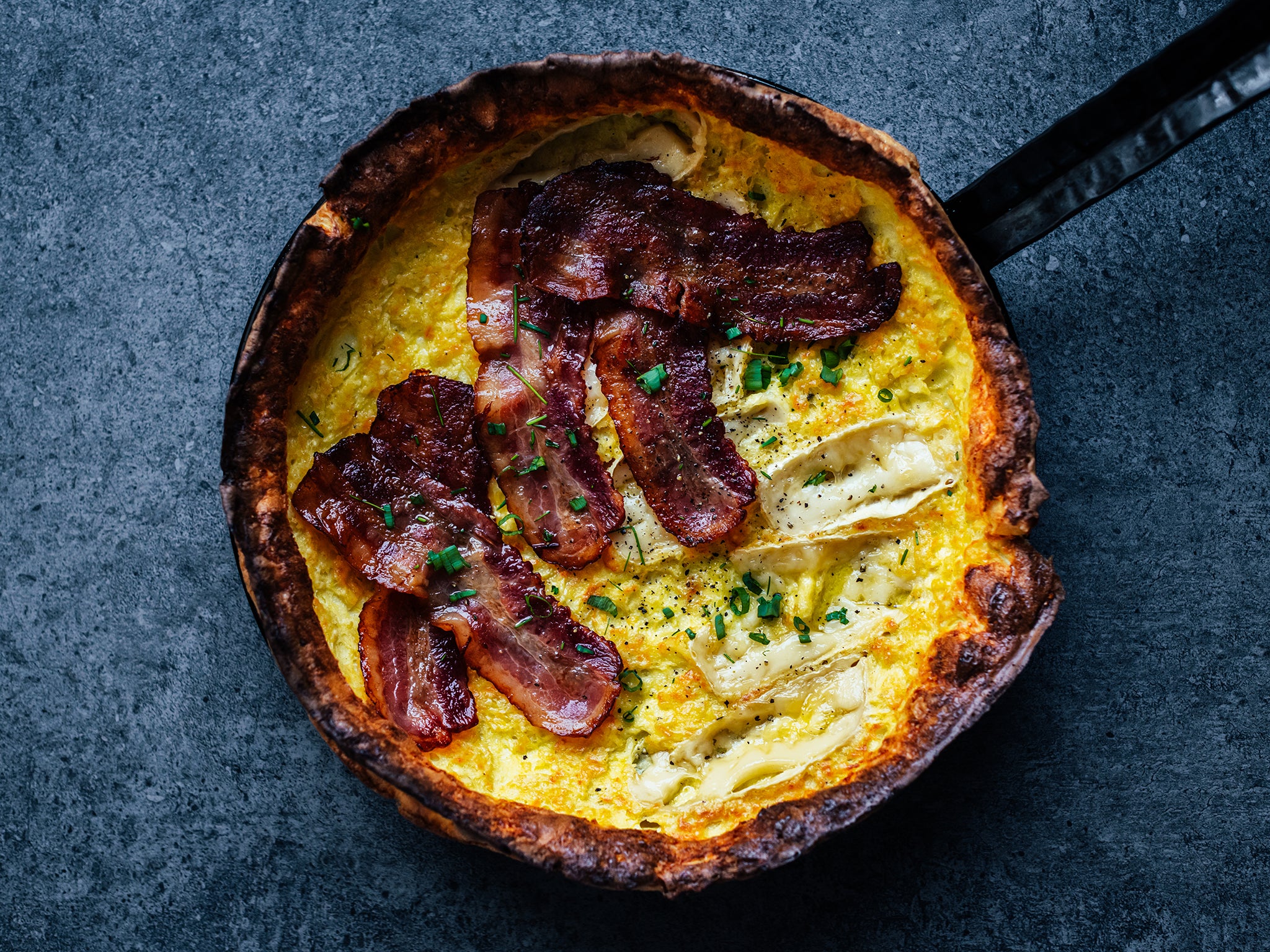 Dutch baby with bacon and runny camembert