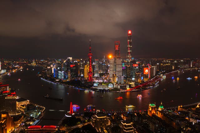 <p>An aerial view of Shanghai at night</p>