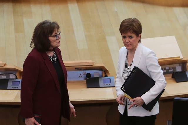 First Minister Nicola Sturgeon, right, and former health secretary Jeane Freeman have both said sending people into care homes untested was a mistake (PA)