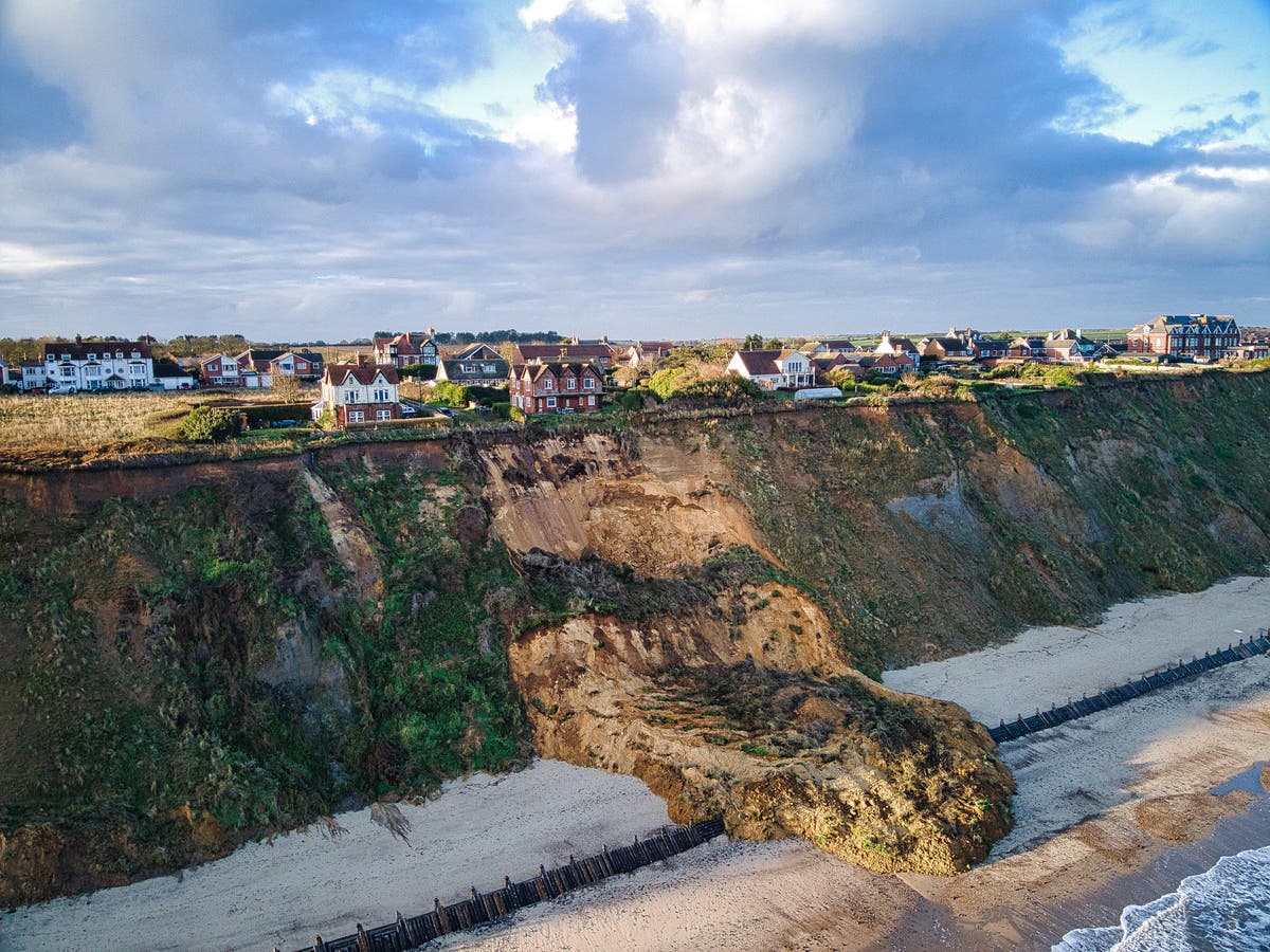 Seaside homes left perched on cliff edge after landslide overnight