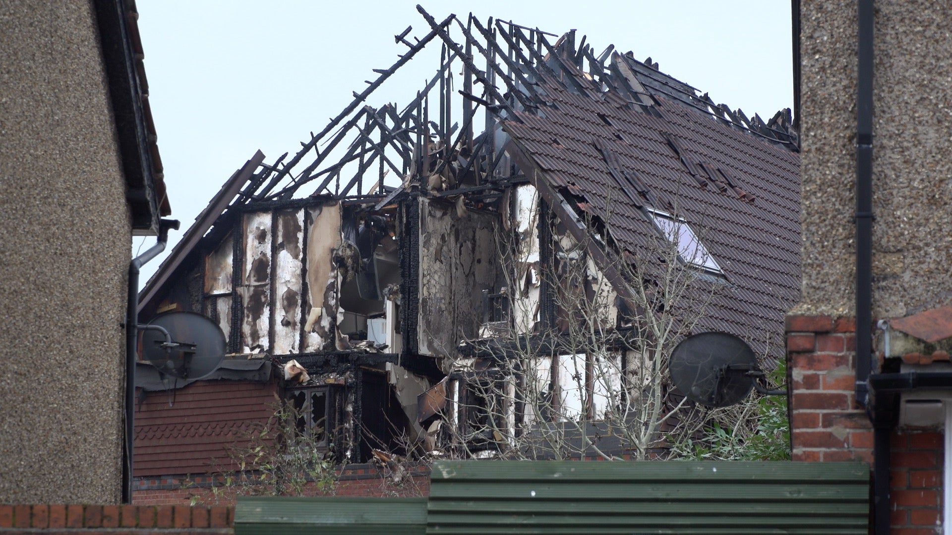 Damage to a property in Grovelands Road, Reading, where one person has died and others are “unaccounted for” in a large fire. Police have arrested a 31-year-old man on suspicion of murder and arson. Picture date: Wednesday December 15, 2021.