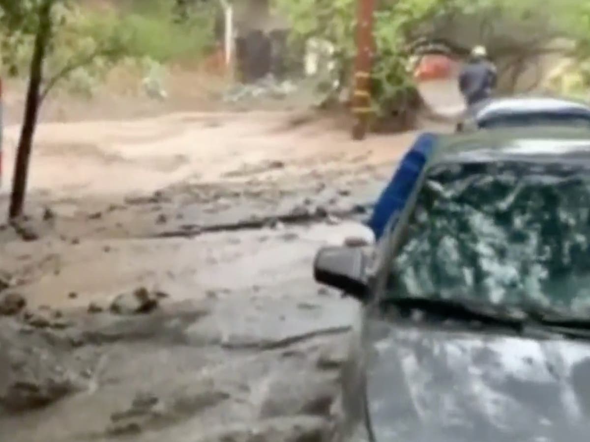 Rivers of mud flow from wildfire burn scar through California homes after powerful storm