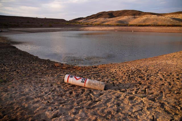 <p>A buoy rests on the ground at a closed boat ramp on Lake Mead near Boulder City, Nevada in August amid the megadrought in the US West</p>