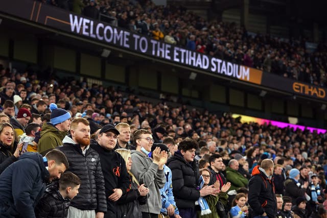 <p>Manchester City fans at the Etihad Stadium earlier this week</p>