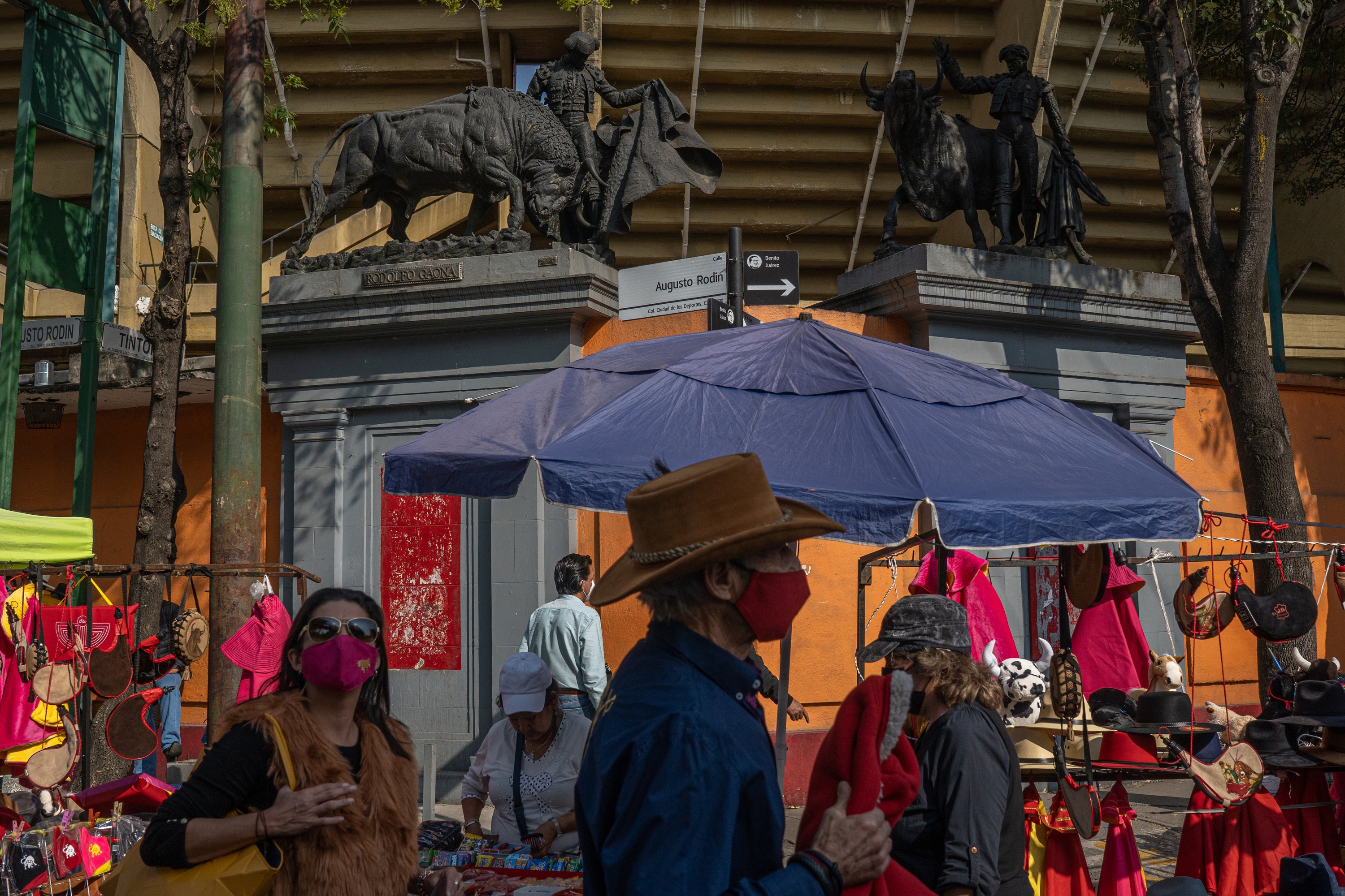 Vendors sell bullfighting merchandise outside the stadium in Mexico City