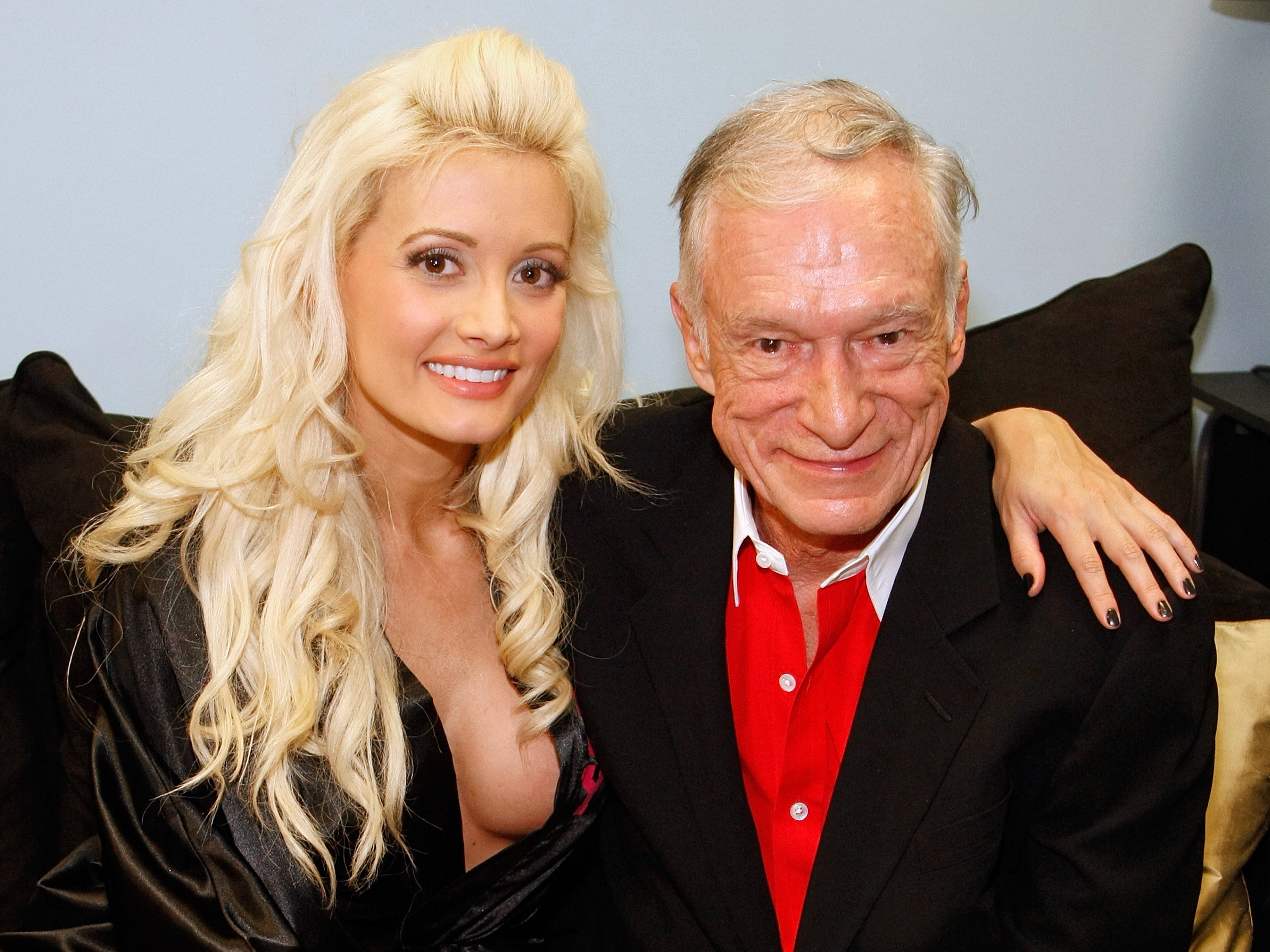 Television personality and model Holly Madison (L) and Playboy founder Hugh Hefner appear in Madison's dressing room after Hefner attended the adult production, "PEEPSHOW" starring Madison at the Planet Hollywood Resort & Casino July 18, 2009