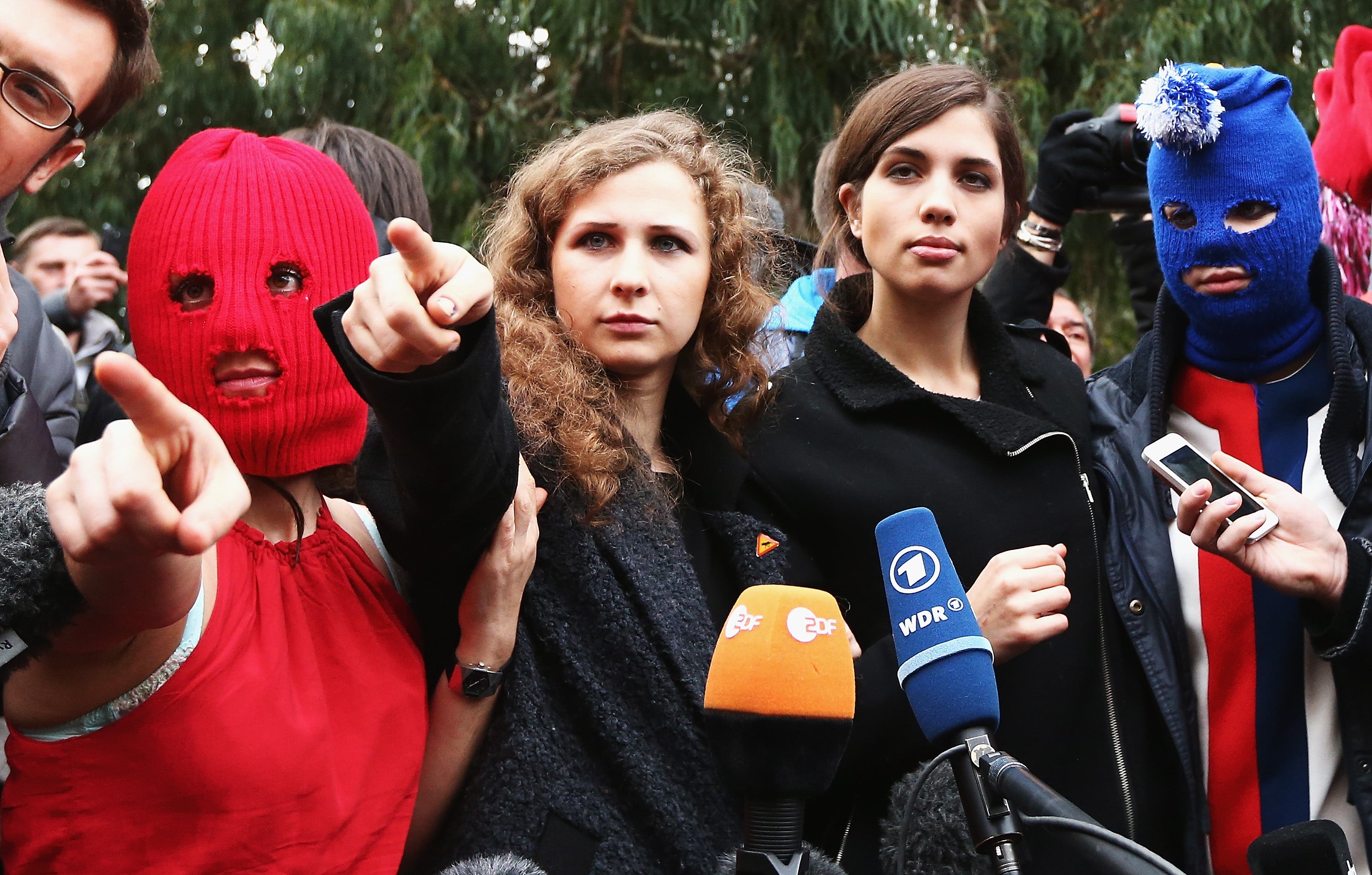 Members of protest group Pussy Riot speak during a press conference in Sochi