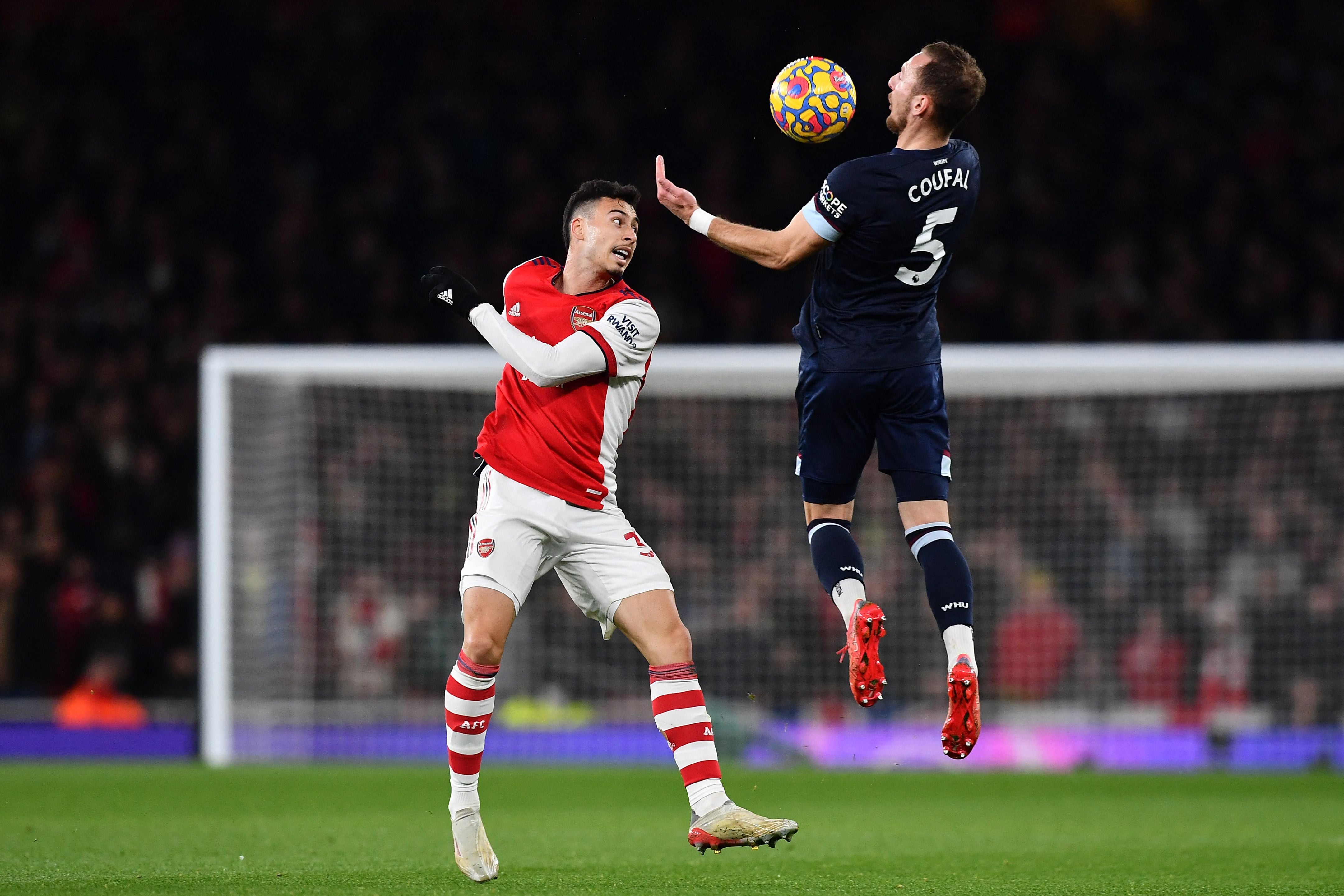 Arsenal striker Gabriel Martinelli (L) vies with West Ham’s Vladimir Coufal