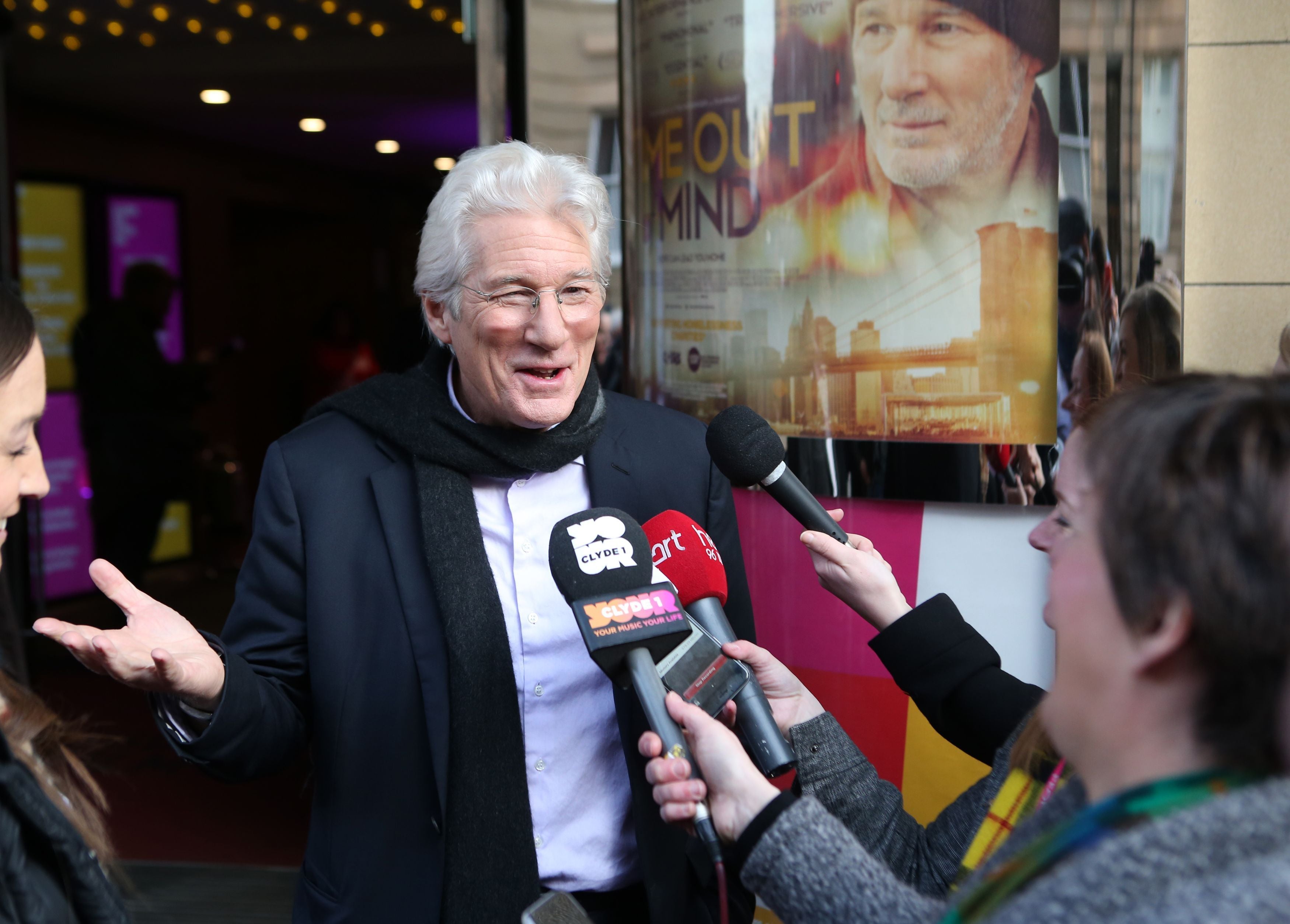 Richard Gere talks to waiting media as he attends the UK premiere of his movie, Time Out of Mind, at the Glasgow Film Theatre, as part of the Glasgow Film Festival. (Andrew Milligan/PA)