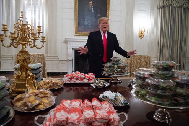 <p>File: Donald Trump speaks alongside fast food he purchased for a ceremony honoring the 2018 College Football Playoff  </p>