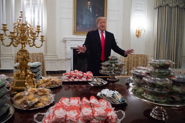 <p>File: Donald Trump speaks alongside fast food he purchased for a ceremony honoring the 2018 College Football Playoff  </p>