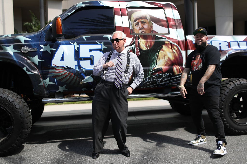 Roger Stone, the longtime confidante of former President Donald Trump, poses in front of a truck
