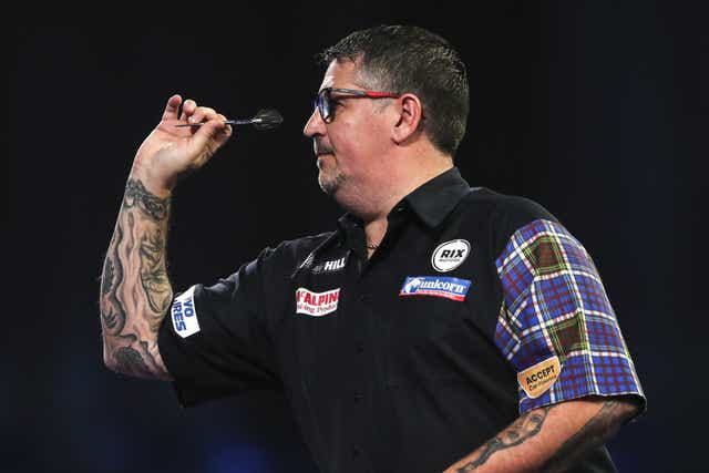 Gary Anderson beat fellow former champion Adrian Lewis at the World Championship (Kieran Cleeves/PA)