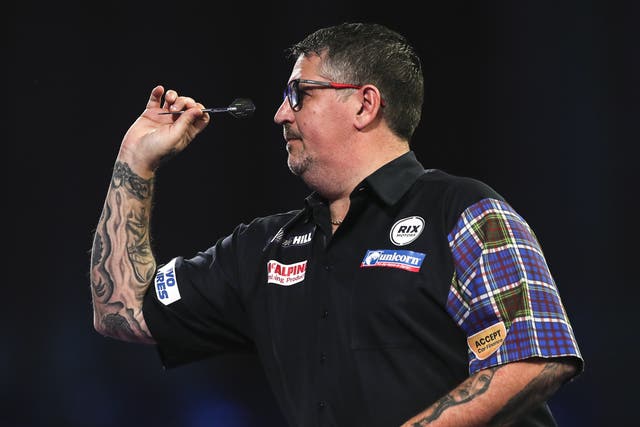 Gary Anderson beat fellow former champion Adrian Lewis at the World Championship (Kieran Cleeves/PA)