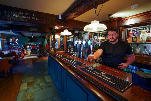 Keith McGimpsey, landlord at the Bull and Dog pub and restaurant in Ormskirk, prepares to open after more bookings were cancelled. Hospitality firms are ramping up calls for support from the Government for hard-hit pubs and restaurants as the Omicron variant sweeps the country and consumer confidence is knocked by new restrictions and increasing health warnings. Picture date: Thursday December 16, 2021.