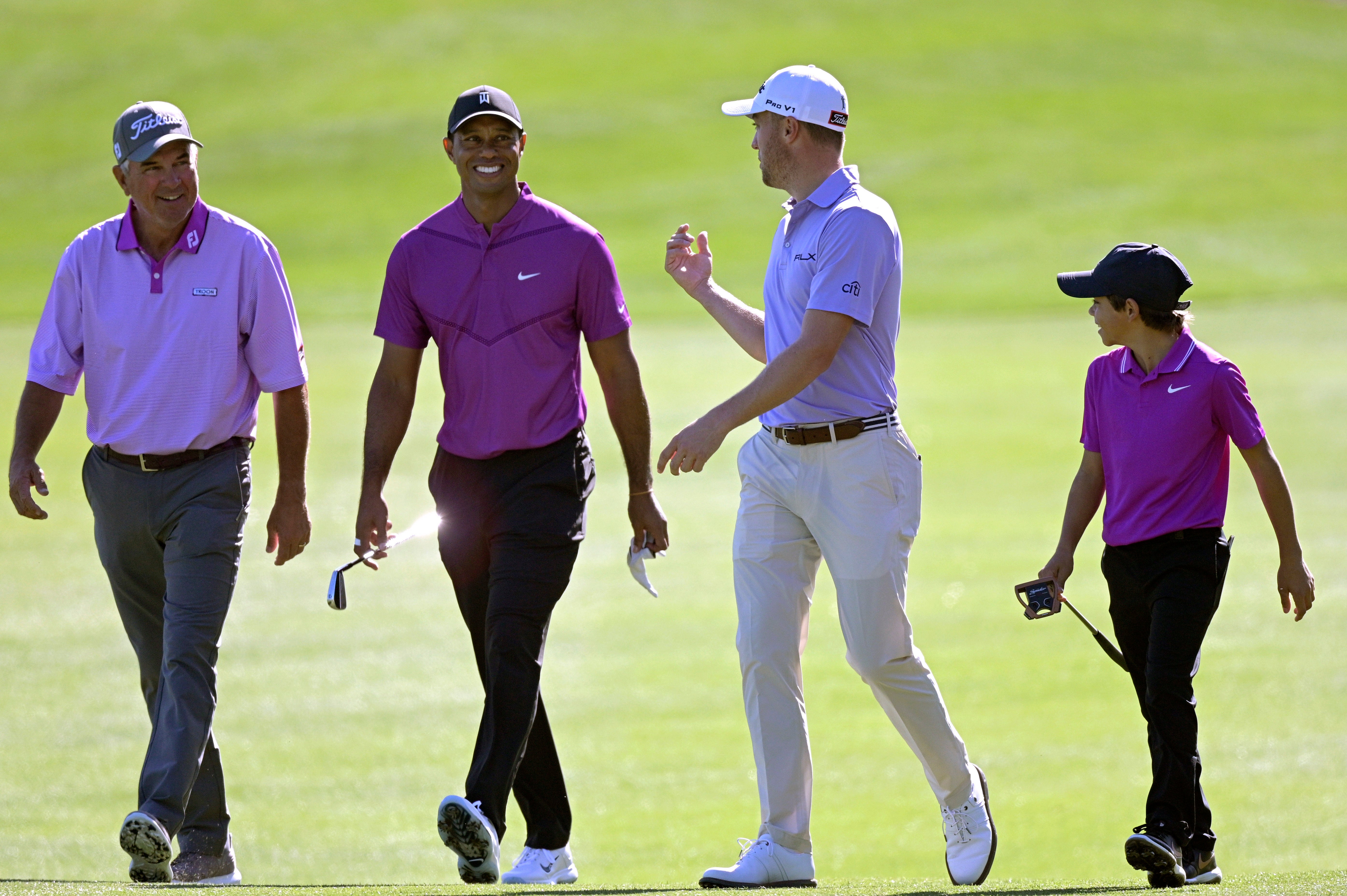 Tiger Woods, second from left, and his son Charlie, right, will play with Justin Thomas, second from right, and his father Mike Thomas the PNC Championship (Phelan M. Ebenhack/AP)