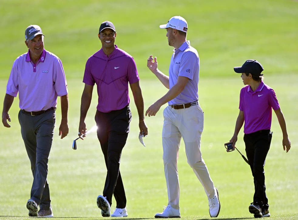 Tiger Woods, second from left, and his son Charlie, right, will play with Justin Thomas, second from right, and his father Mike Thomas the PNC Championship (Phelan M. Ebenhack/AP)