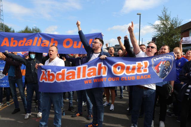 <p>Oldham fans protest against owner Abdallah Lemsagem </p>