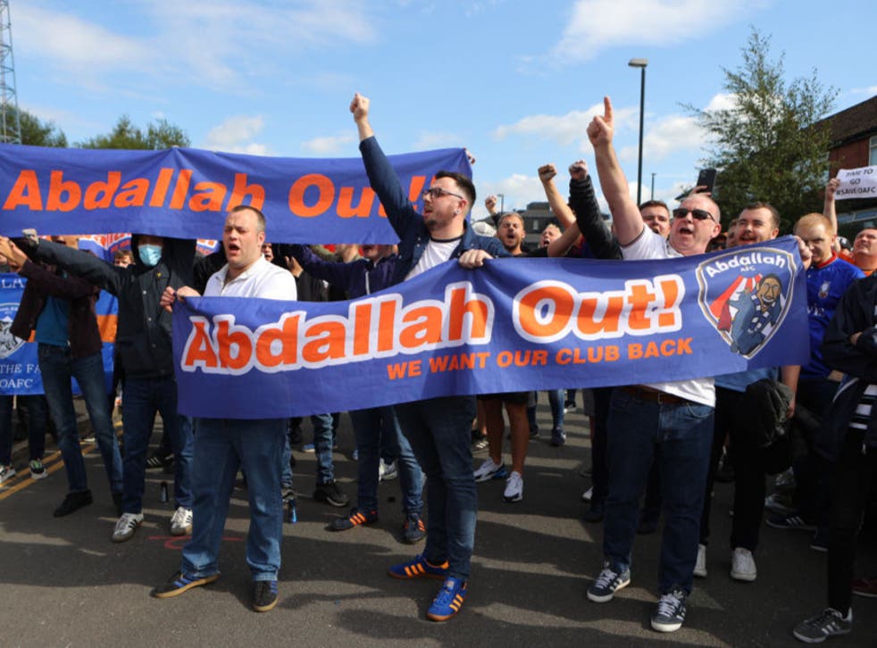 <p>Oldham fans protest against owner Abdallah Lemsagem </p>