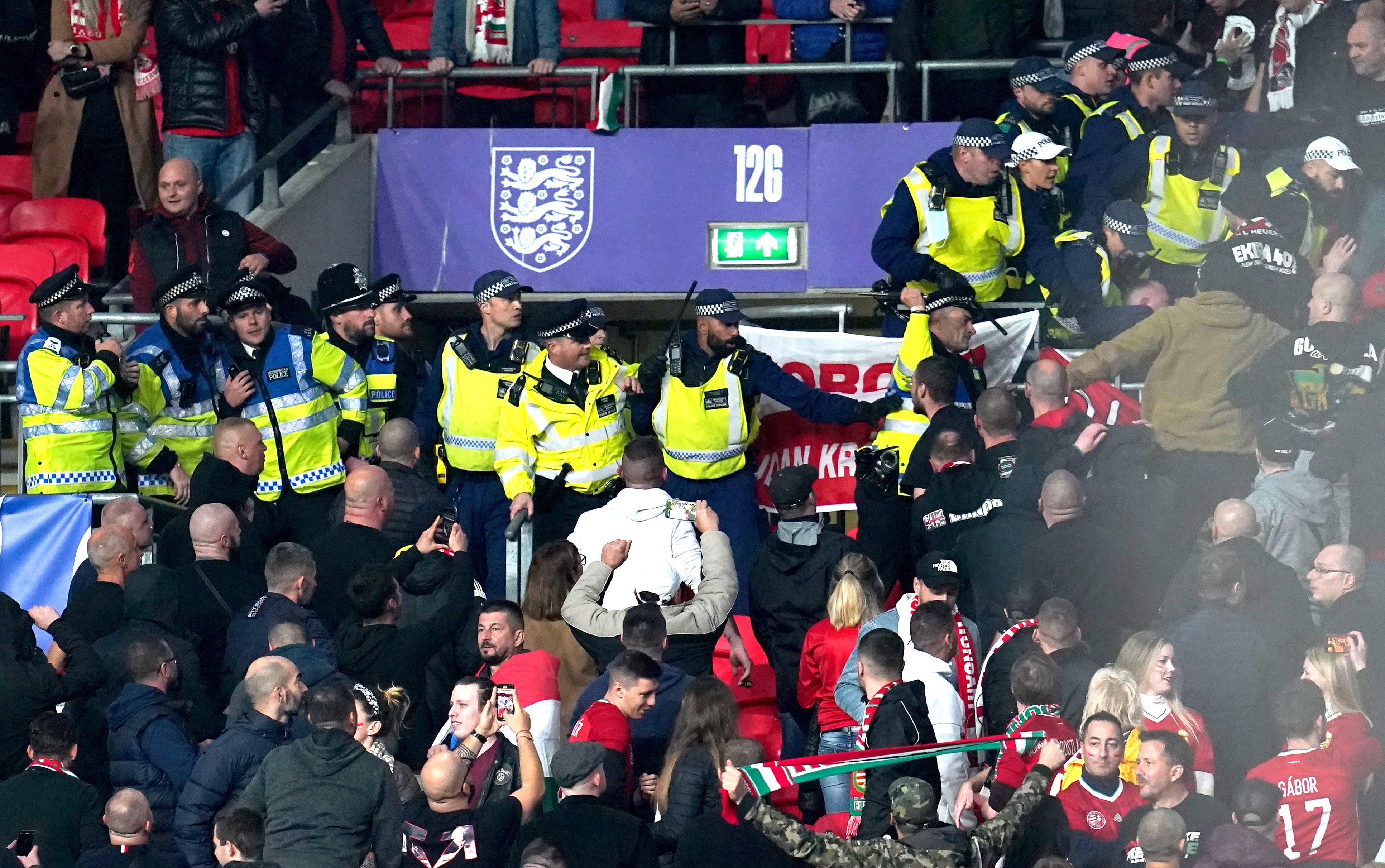 Hungary fans clash with police officers in the stands during October’s World Cup qualifier at Wembley (Nick Potts/PA)