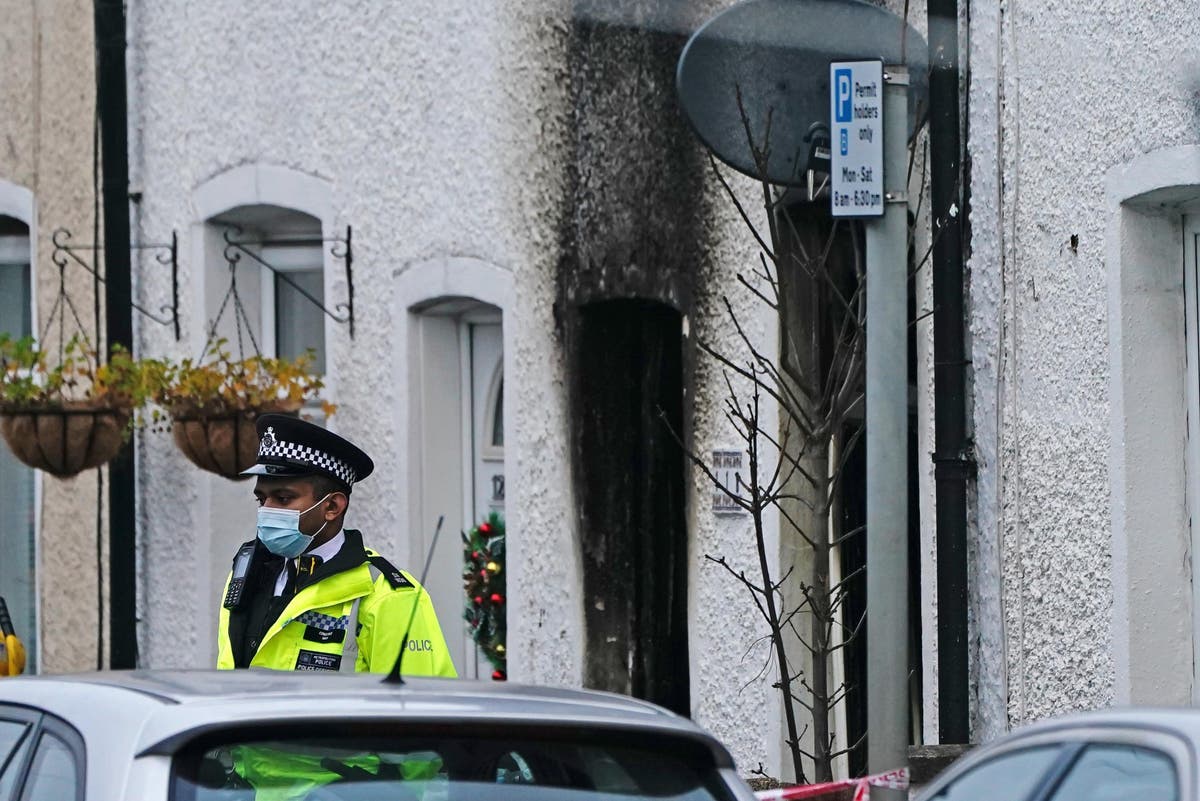 Woman arrested after two sets of twin boys die in house fire
