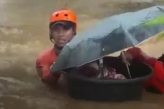 <p>Philippines coast guards rescued a one-month-old baby in a tub as typhoon Rai battered the country </p>