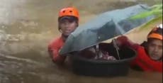 Philippines typhoon Rai: Month-old baby rescued to safety in a tub