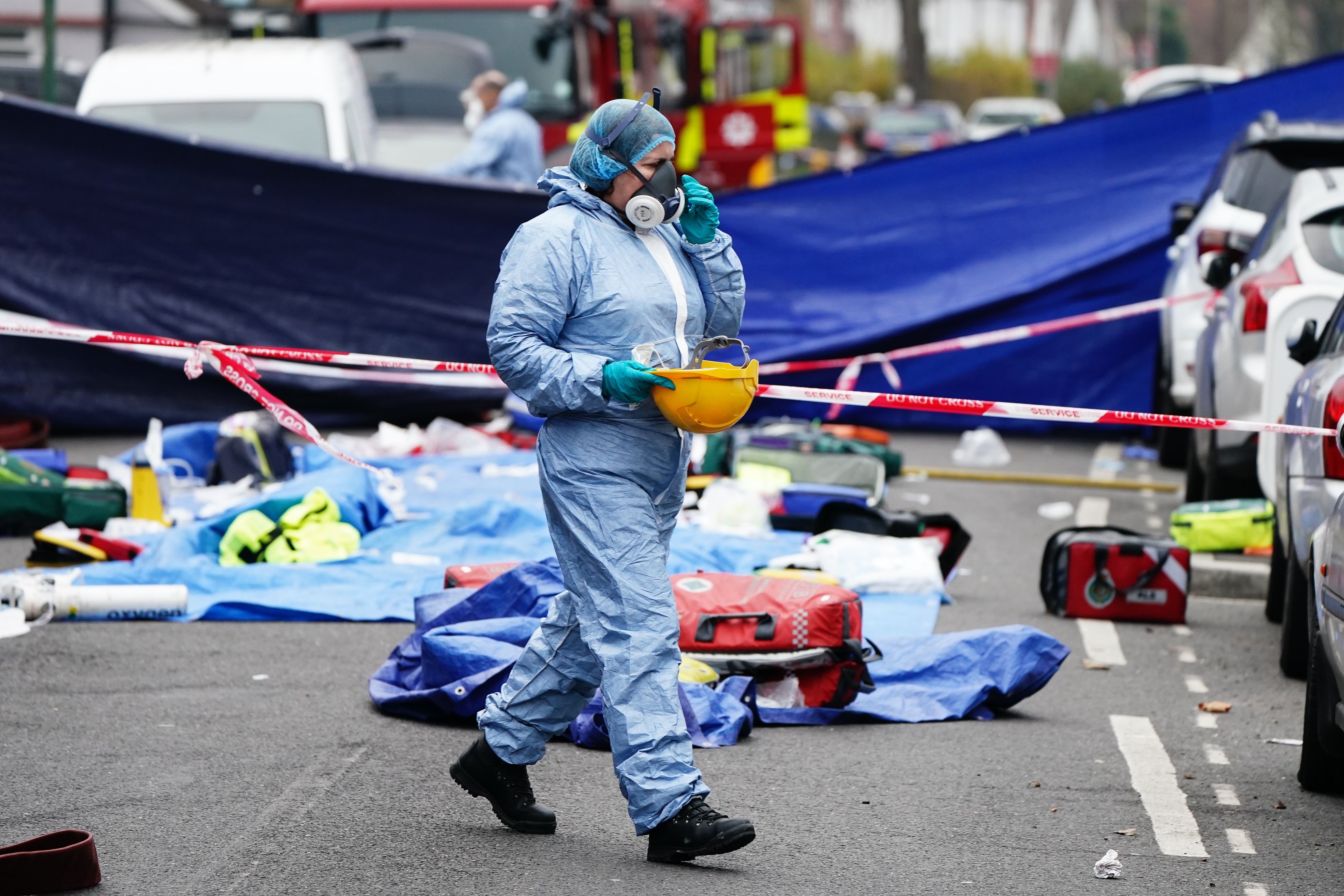 Forensic investigators at the scene in Collingwood Road, Sutton