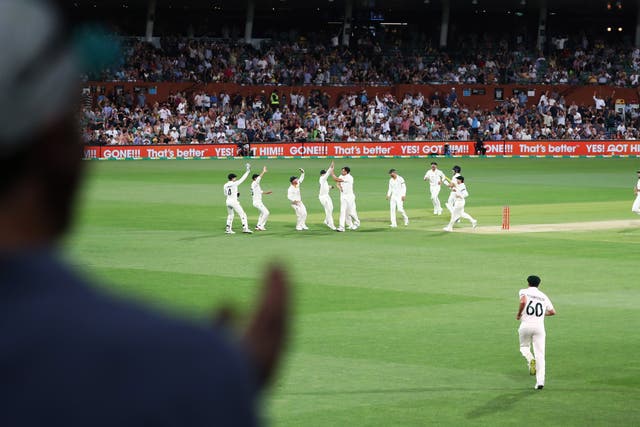Australia’s Mitchell Starc celebrates the wicket of England’s Rory Burns (Jason O’Brien/PA)