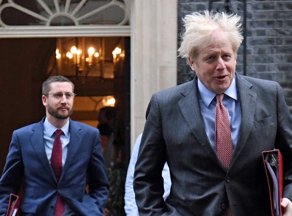 <p>The prime minister Boris Johnson with the UK’s top civil servant, Simon Case</p>