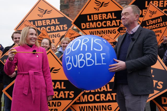 Newly elected Liberal Democrat MP Helen Morgan, bursts ‘Boris’ bubble’ held by colleague Tim Farron (Jacob King/PA)