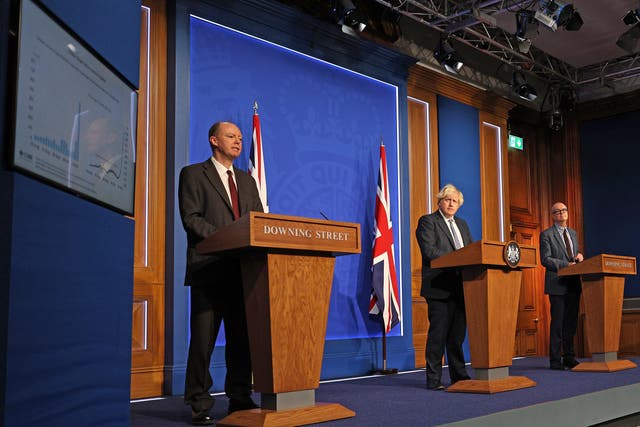 Prime Minister Boris Johnson, centre, suggested he and England’s chief medical officer Professor Chris Whitty left, are on the same page (Adrian Dennis/PA)
