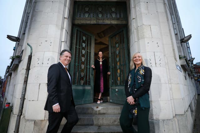 Lord Mayor of Belfast Kate Nicholl (centre), Suzanne Wylie, chief executive of Belfast City Council and chair of the Belfast Region City Deal Executive Board, and Richard Williams, chief executive of NI Screen, at the Bank of Ireland building on Royal Avenue (Kelvin Boyes /Press Eye/PA)