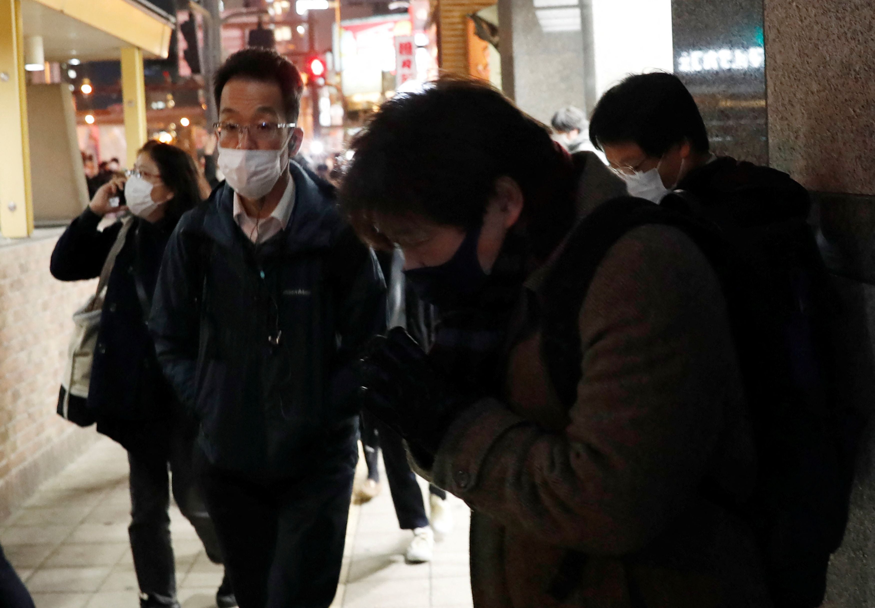 A mourner prays for victims