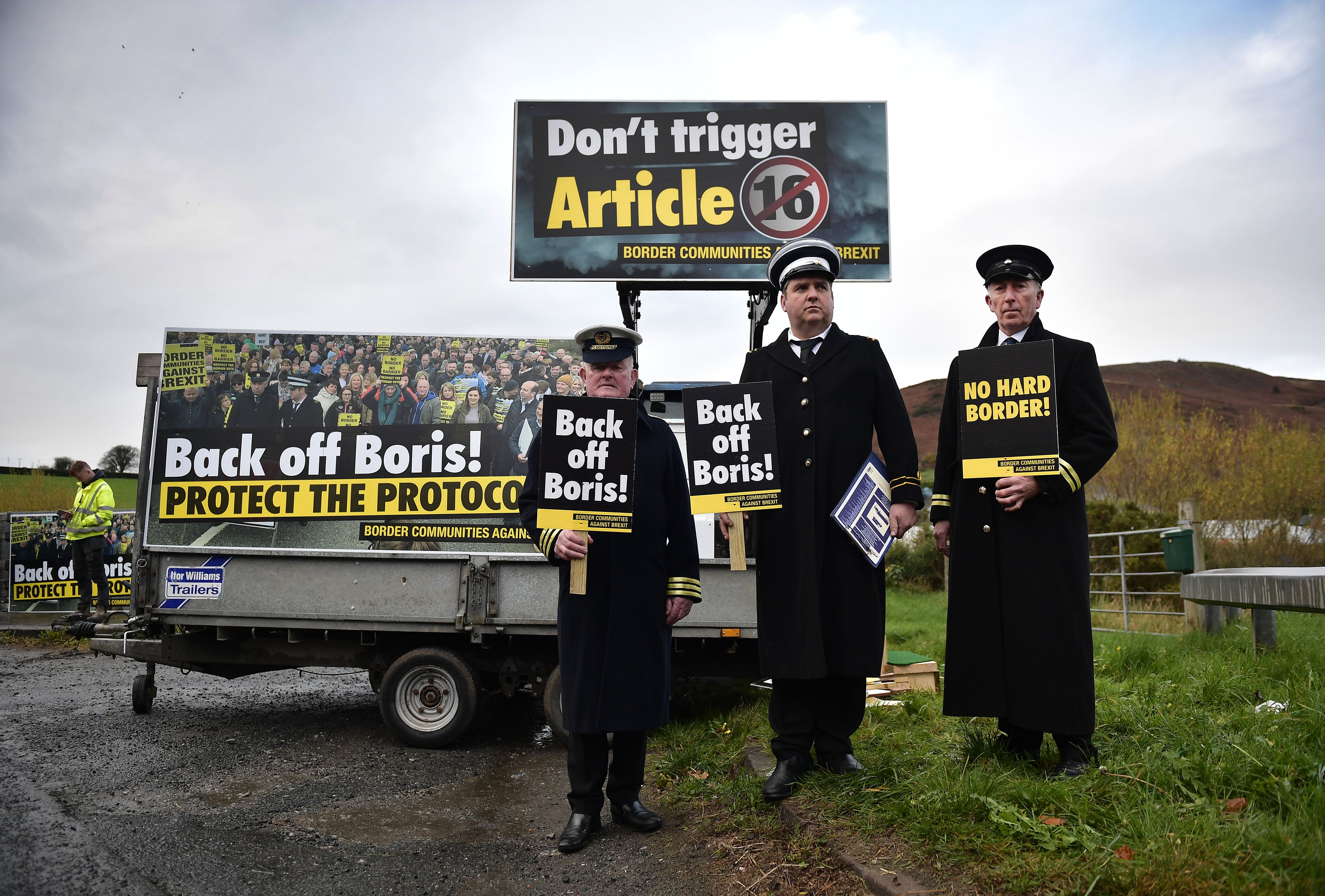 Protesters dressed as customs officials man an unofficial checkpoint on the Irish border