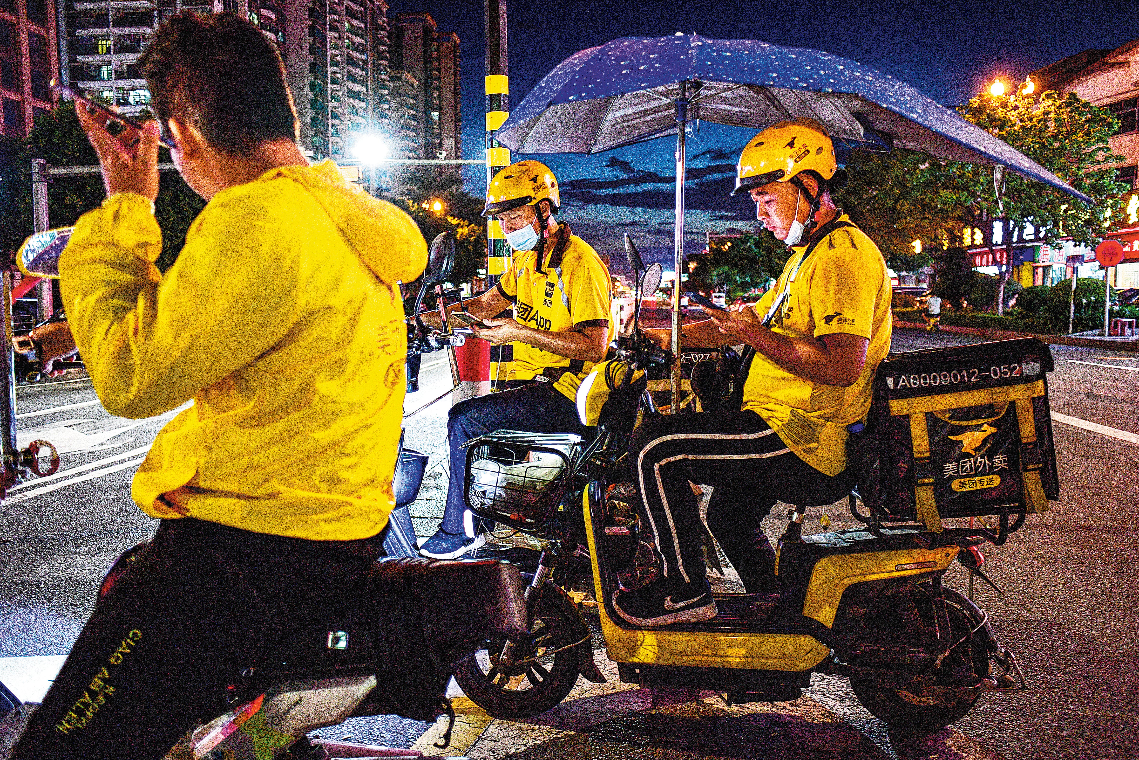 Deliverers work in Dongguan, Guangdong province