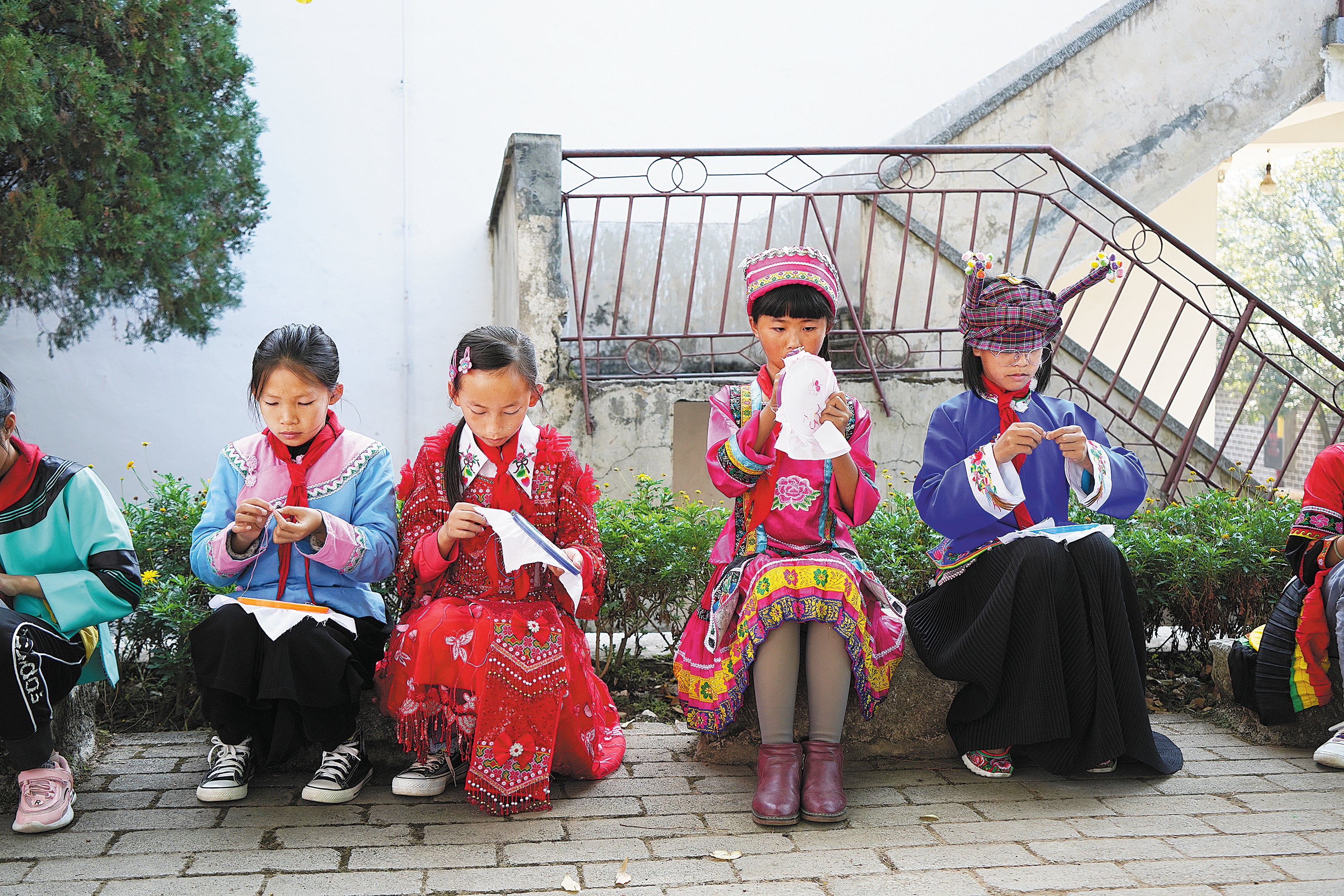 Students learn needlework at No 1 Primary School in Guangnan county, Yunnan province